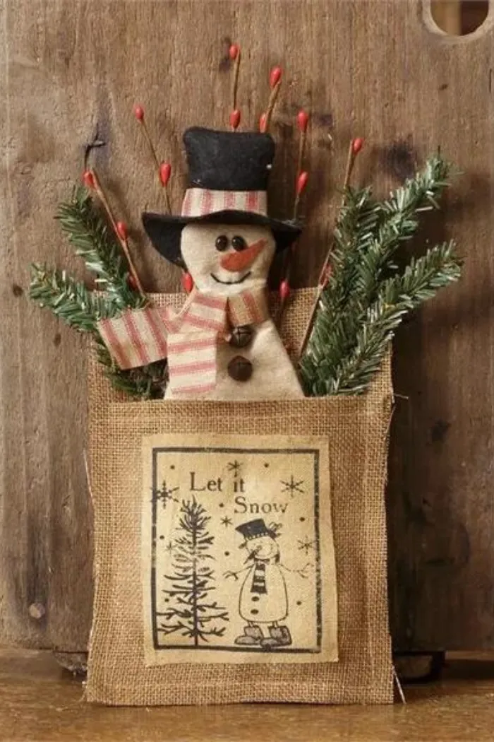 PRIMITIVE SNOWMAN IN BAG "LET IT SNOW" ORNAMENT